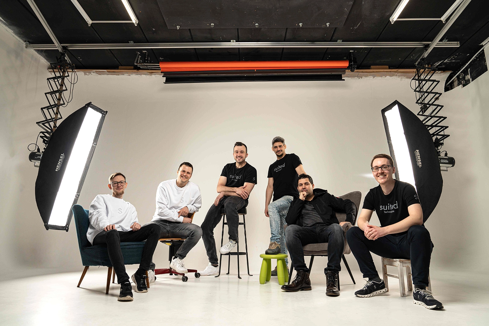 Suited Technologies team in professional studio setting